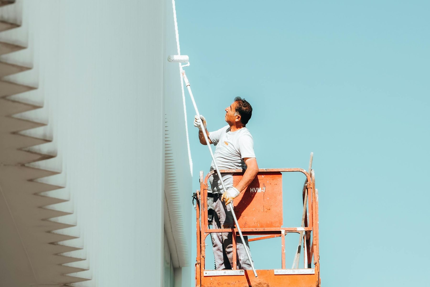 Painter working from an elevated platform